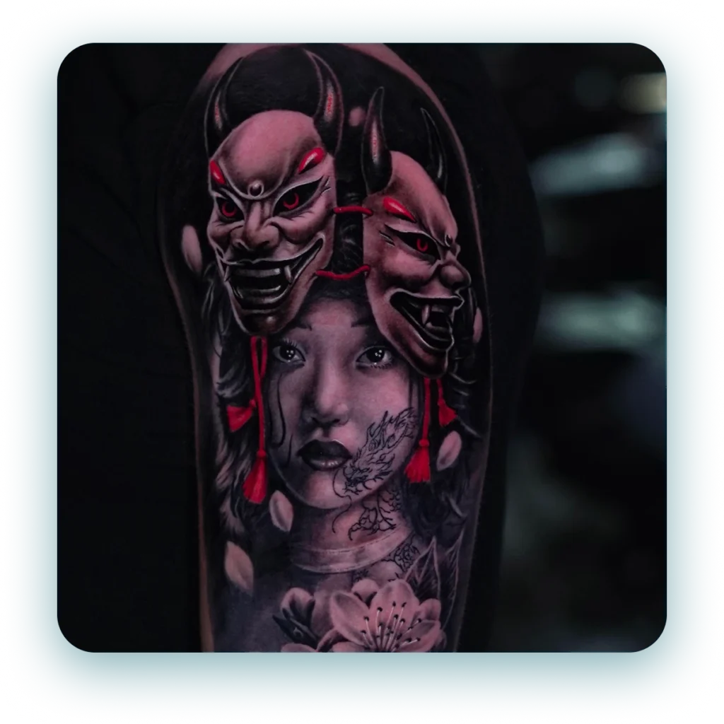 oni-mask-abstract-tattoo-with-red-highlights-black-and-grey-realism