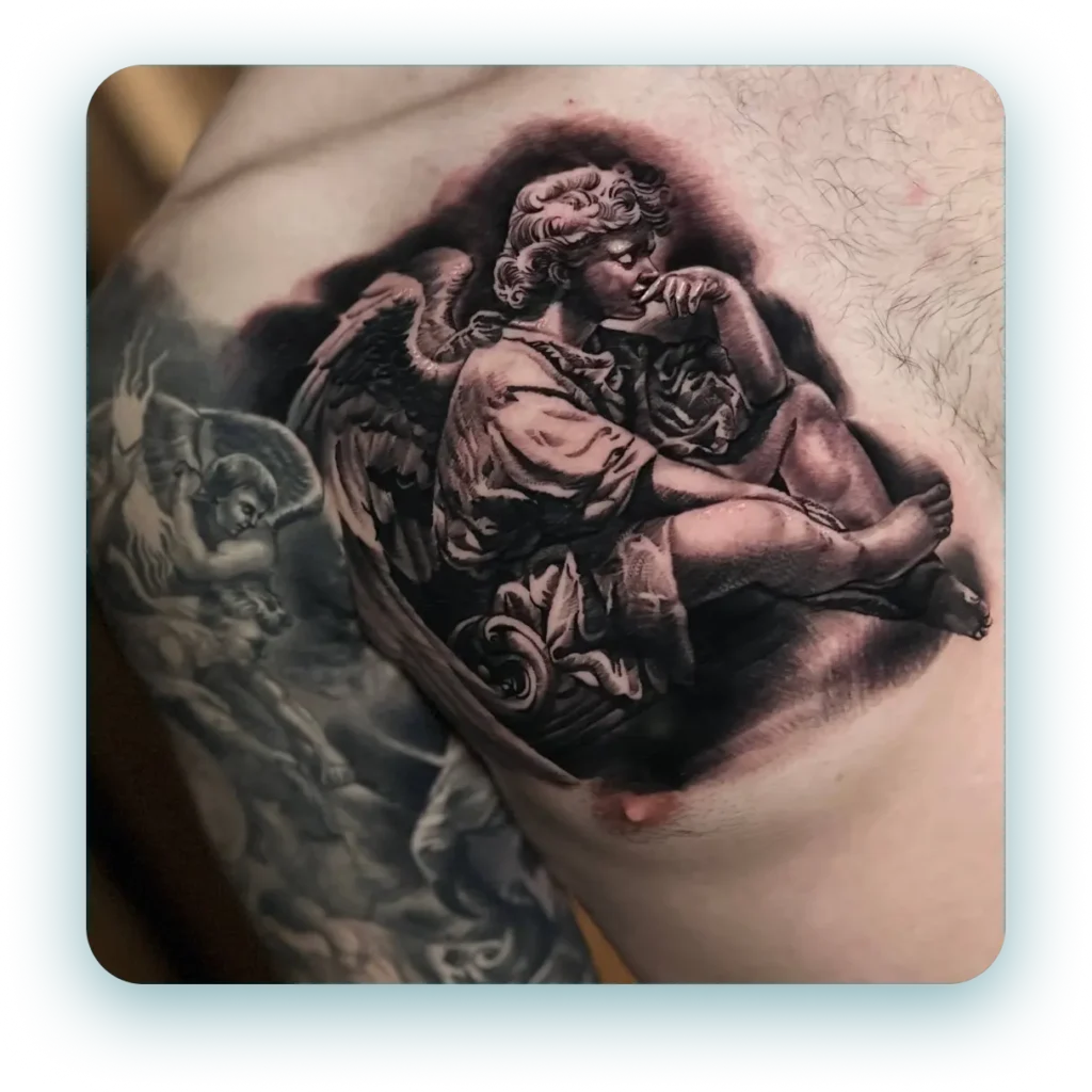 renaissance Michael Angelo inspired angel statue chest tattoo black and white and grey realism realistic tattoo